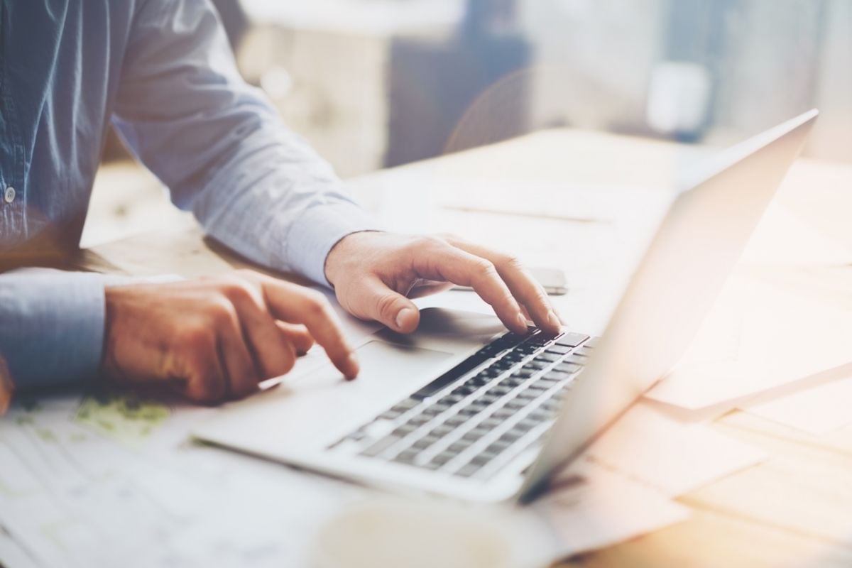 Man using a laptop on a table